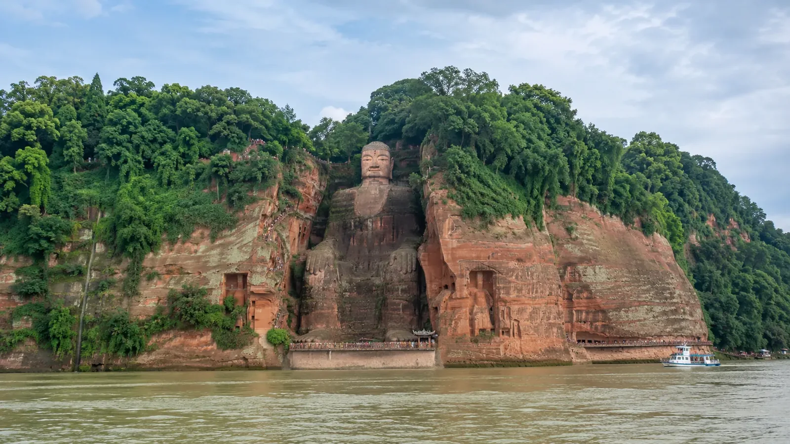 Leshan Giant Buddha carved into a riverside cliff above the meeting of Sichuan rivers